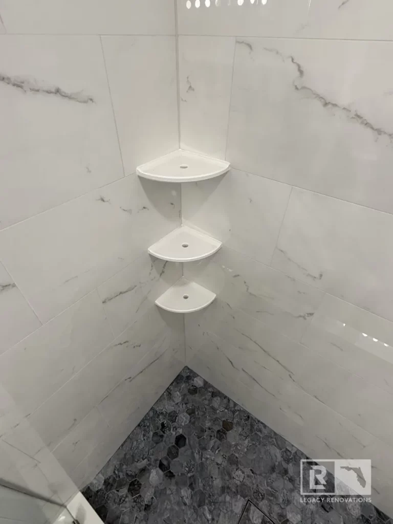Close-up of a modern bathroom organizer with white marble-style tiles